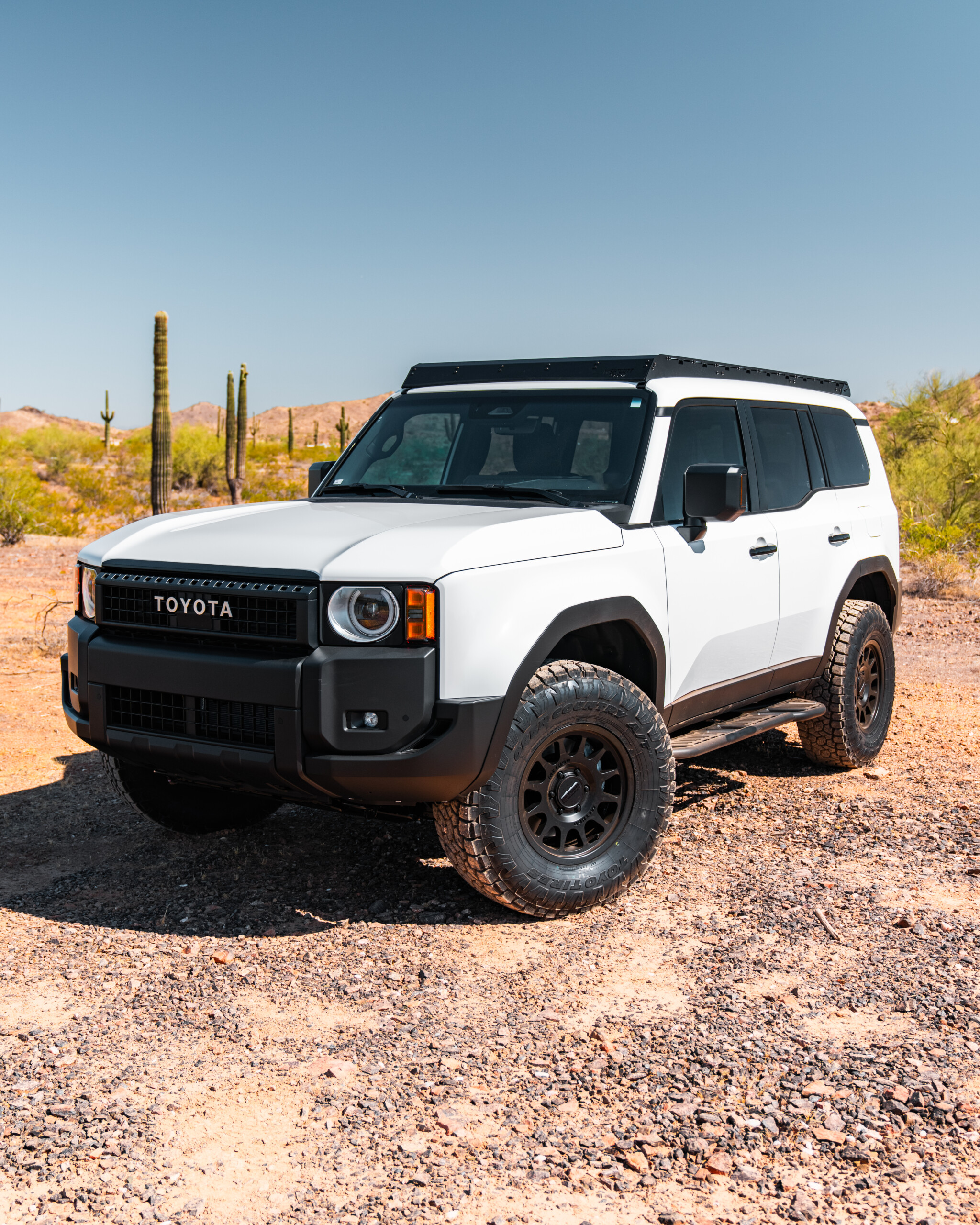 2024 Toyota Land Cruiser LC250 Modular Roof Rack by Westcott Designs. White LC250 3/4 View.