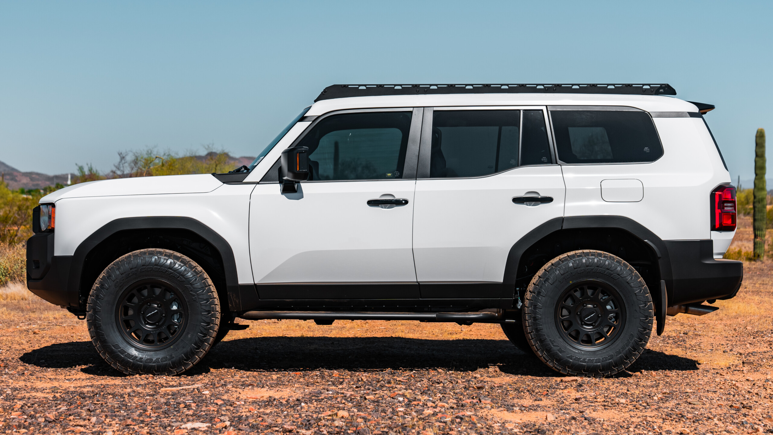 2024 Toyota Land Cruiser LC250 Modular Roof Rack by Westcott Designs. White LC250 Profile View.